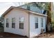 Sunroom addition to home features bright, natural light with multiple windows at 1408 Edgebrook Dr, Garner, NC 27529