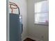 This utility room features a water heater and a window for natural light at 1408 Edgebrook Dr, Garner, NC 27529