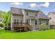 Nice backyard featuring a well-manicured lawn, patio, and a wooden deck, great for entertaining at 144 Cobble Ridge Dr, Pittsboro, NC 27312