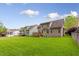 Expansive backyard featuring a lush green lawn and a wooden deck perfect for outdoor entertaining at 144 Cobble Ridge Dr, Pittsboro, NC 27312