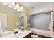Bathroom with neutral walls, a vanity, and a shower with patterned curtains at 144 Cobble Ridge Dr, Pittsboro, NC 27312