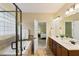 Bathroom with glass shower, soaking tub, and double sink vanity at 144 Cobble Ridge Dr, Pittsboro, NC 27312