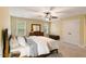 Bedroom with a bed, dresser, and two windows at 144 Cobble Ridge Dr, Pittsboro, NC 27312