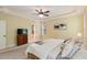 Bright bedroom featuring a ceiling fan, neutral walls, and carpet at 144 Cobble Ridge Dr, Pittsboro, NC 27312