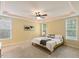 Serene bedroom with tray ceilings, natural light, and neutral décor at 144 Cobble Ridge Dr, Pittsboro, NC 27312