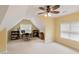 Large bonus room with neutral carpet and ceiling fan, perfect for work or play at 144 Cobble Ridge Dr, Pittsboro, NC 27312