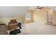 Bonus room with tan carpet and neutral walls, ready for your personal touch at 144 Cobble Ridge Dr, Pittsboro, NC 27312