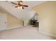Spacious bonus room features cozy carpet and a ceiling fan for added comfort at 144 Cobble Ridge Dr, Pittsboro, NC 27312