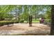 Beautiful park area with lush trees, manicured bushes, walking paths and multiple benches at 144 Cobble Ridge Dr, Pittsboro, NC 27312
