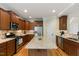 Well-equipped kitchen with stainless steel appliances, granite countertops, and ample cabinet space at 144 Cobble Ridge Dr, Pittsboro, NC 27312