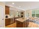 Open kitchen area boasts stainless appliances, a breakfast nook, and seamless living space flow at 144 Cobble Ridge Dr, Pittsboro, NC 27312