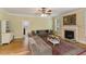 Comfortable living room with a fireplace, inviting couches, and hardwood floors at 144 Cobble Ridge Dr, Pittsboro, NC 27312