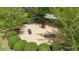 Community park featuring gravel area, artistic statue, benches, and landscaped bushes at 144 Cobble Ridge Dr, Pittsboro, NC 27312