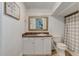Charming bathroom features a pedestal sink and patterned shower curtain at 1542 Albright Ave, Burlington, NC 27215