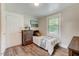 Neutral bedroom offers natural light and charming decor at 1542 Albright Ave, Burlington, NC 27215