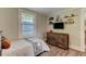 Neutral bedroom features a large window and sleek furniture at 1542 Albright Ave, Burlington, NC 27215