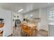 Cozy kitchen features a light wood dining table and white cabinets at 1542 Albright Ave, Burlington, NC 27215