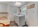 Functional laundry room with washer and dryer and adjacent breakfast nook at 1542 Albright Ave, Burlington, NC 27215