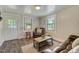 Cozy living room with hardwood floors, neutral paint, and comfortable leather furniture with natural light at 1542 Albright Ave, Burlington, NC 27215