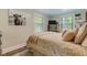 Well-lit bedroom is decorated with a window view and warm tones at 1542 Albright Ave, Burlington, NC 27215