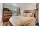 Bedroom features a window and a dark wood dresser and bed frame at 1542 Albright Ave, Burlington, NC 27215