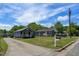 View of houses with well-kept lawns and a long driveway leading to one of the homes at 1542 Albright Ave, Burlington, NC 27215