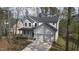 Beautiful two-story home with an attached two-car garage surrounded by mature trees at 157 Maplewood Dr, Sanford, NC 27332