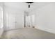 Bedroom with a ceiling fan, two large windows, and a double closet at 157 Maplewood Dr, Sanford, NC 27332