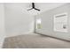 Bedroom featuring a ceiling fan and two windows at 157 Maplewood Dr, Sanford, NC 27332