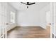 Office/bedroom featuring hardwood floors, an open doorway, and white trim at 157 Maplewood Dr, Sanford, NC 27332