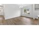 Bright dining space featuring hardwood floors, a chandelier, and a large window at 157 Maplewood Dr, Sanford, NC 27332