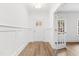 Entryway showcasing hardwood floors, wainscoting, and an open doorway at 157 Maplewood Dr, Sanford, NC 27332
