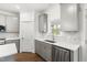 Well-equipped kitchen with gray cabinets, stainless steel appliances, and modern fixtures at 157 Maplewood Dr, Sanford, NC 27332