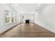 Spacious living room boasts hardwood floors, recessed lighting, and a cozy fireplace at 157 Maplewood Dr, Sanford, NC 27332