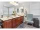 Bathroom featuring dual sinks and a large mirror at 161 Fort Jackson Rd, Morrisville, NC 27560