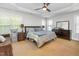 This spacious bedroom features a ceiling fan, sitting area, and large dresser at 161 Fort Jackson Rd, Morrisville, NC 27560