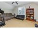Bonus room features ample seating, a bookshelf, and a window at 161 Fort Jackson Rd, Morrisville, NC 27560