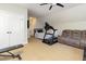 Bonus room features exercise equipment and a comfortable seating area at 161 Fort Jackson Rd, Morrisville, NC 27560