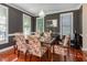 Elegant dining room with chandelier lighting and gleaming hardwood floors at 161 Fort Jackson Rd, Morrisville, NC 27560