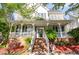 Charming home featuring a welcoming front porch and manicured landscaping at 161 Fort Jackson Rd, Morrisville, NC 27560
