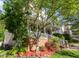 Beautiful home with a covered front porch, well-maintained lawn, landscaping, and a stone-lined garden at 161 Fort Jackson Rd, Morrisville, NC 27560