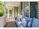 Relaxing front porch featuring a comfortable couch with decorative pillows at 161 Fort Jackson Rd, Morrisville, NC 27560