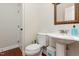 Convenient half bathroom featuring a pedestal sink and neutral decor at 161 Fort Jackson Rd, Morrisville, NC 27560
