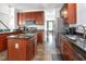 Well-equipped kitchen with cherry cabinetry, and stainless steel appliances at 161 Fort Jackson Rd, Morrisville, NC 27560
