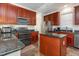 Functional kitchen boasts dark granite countertops and ample cabinet space at 161 Fort Jackson Rd, Morrisville, NC 27560