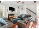Cozy living room with fireplace, hardwood floors, and comfortable seating at 161 Fort Jackson Rd, Morrisville, NC 27560