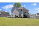 Expansive backyard featuring well-maintained lawn and tasteful landscaping, complemented by a privacy fence at 166 Old Field Loop Loop, Sanford, NC 27332