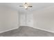 Bedroom showcasing neutral paint, carpet, ceiling fan, and double-door closet at 166 Old Field Loop Loop, Sanford, NC 27332