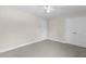 Neutral bedroom with carpet and ceiling fan, showcasing a closet and interior door at 166 Old Field Loop Loop, Sanford, NC 27332