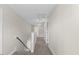 Bright hallway with neutral walls and carpeting, featuring modern lighting and access to multiple rooms at 166 Old Field Loop Loop, Sanford, NC 27332